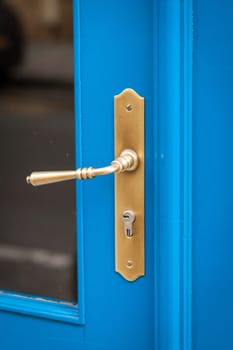 Doorknob doorknob on a wooden door entrance at a house as a close-up