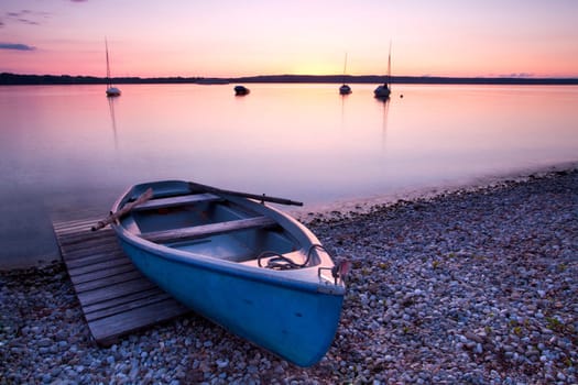 Rowing boat on the lake shore
