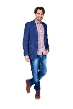 Young man in trendy casual look with dark hair and beard isolated against a white background