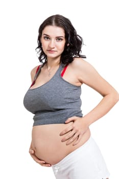 Young woman with baby belly in expectant posture as close-up isolated against white background