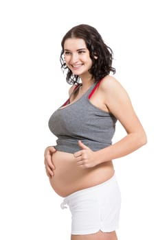 Young woman with baby belly in expectant posture as close-up isolated against white background