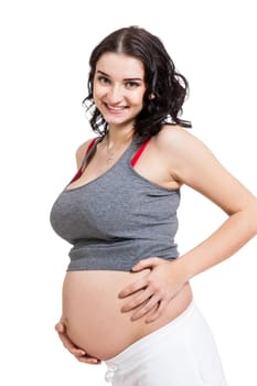 Young woman with baby belly in expectant posture as close-up isolated against white background