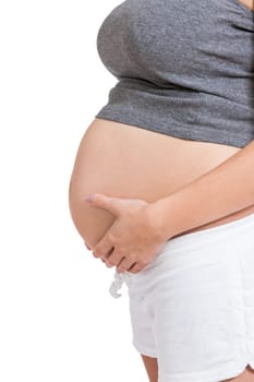 Young woman with baby belly in expectant posture as close-up isolated against white background