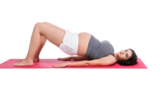 Young woman at birth preparation yoga isolated against white background