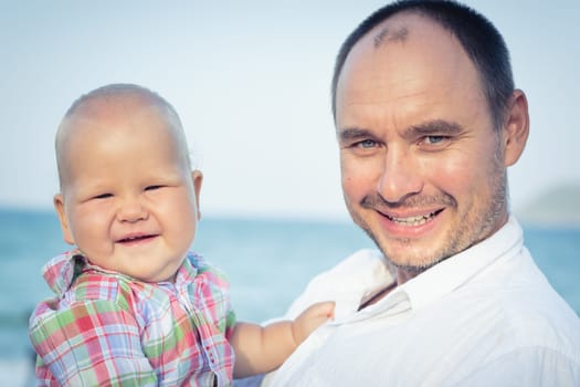 Baby and father outdoor portrait