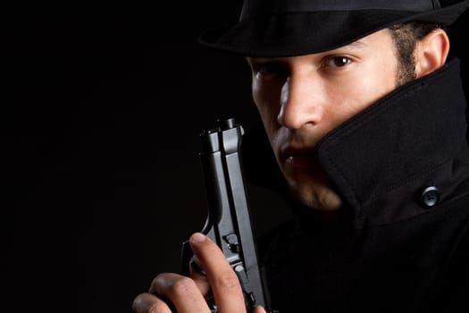 Sneaky spy man holding gun