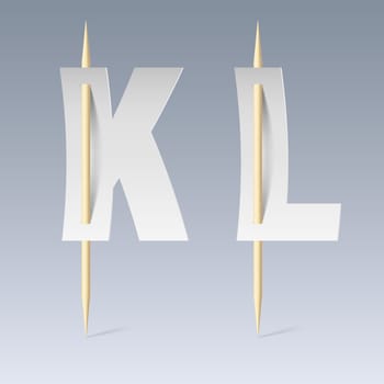 White paper cut font on toothpicks on grey background. K and L letters