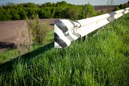 Closeup photo of bump stopper on side of country road