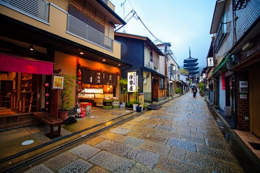 KYOTO, JAPAN - November 25 2013: Tourists walk on a street leading to Kiyomizu Temple on November 25 2013 for Sakura viewing. Kiyomizu is a famous temple in Kyoto built in year 778