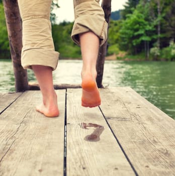 barefoot at the bathing jetty