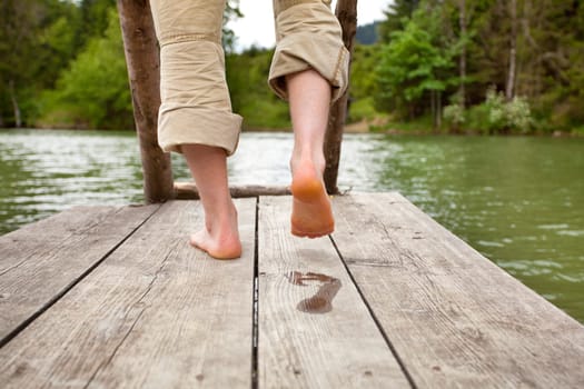 barefoot at the bathing jetty