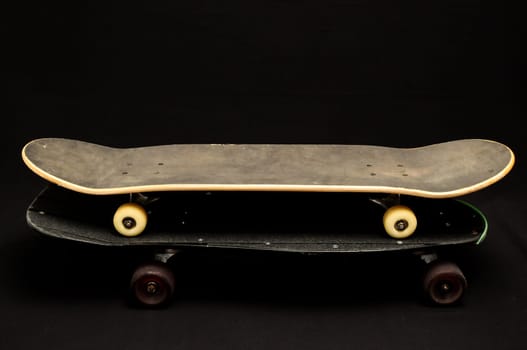 Vintage Style Black Skateboard on a black Background