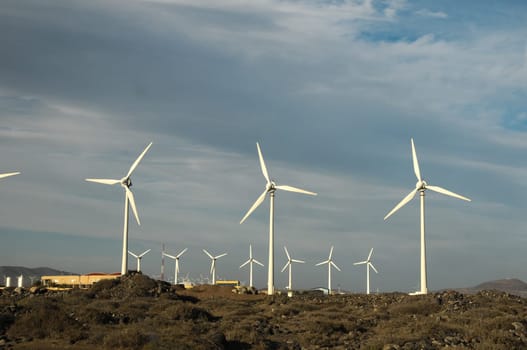 Eletric Power Generator Wind Turbine over a Cloudy Sky