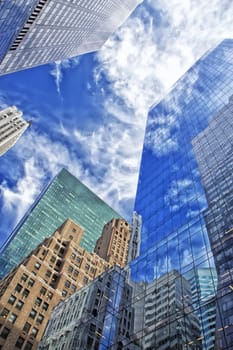 Skyscrapers with clouds reflection (New York City). Vertically.