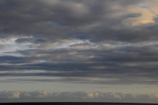 Cloudscape, Colored Clouds at Sunset near the Ocean