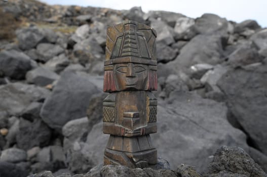 Ancient Maya Statue on the Rocks near Ocean