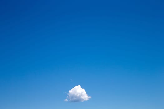 blue sky background with tiny clouds