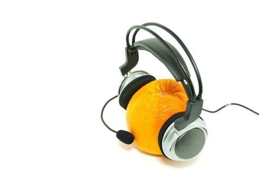 orange and headphones isolated on a white
