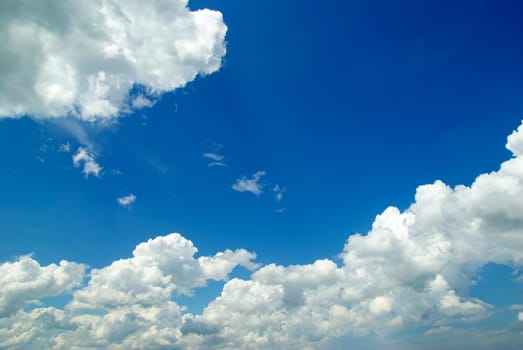 Blue sky background with a tiny clouds
