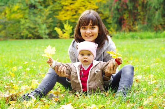 happy mother and baby playing