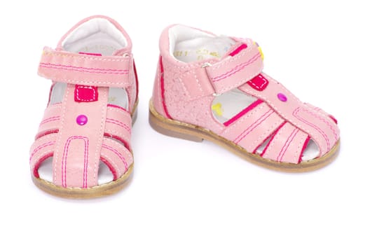 pink child's sandals isolated on white
