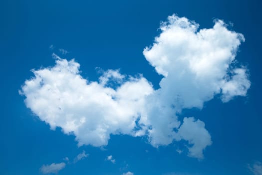 Blue sky background with a tiny clouds