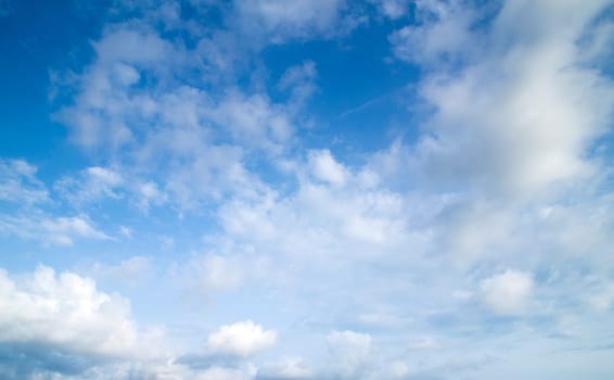 blue sky background with tiny clouds
