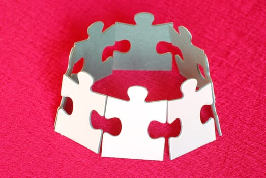 Recycling symbol made from puzzles