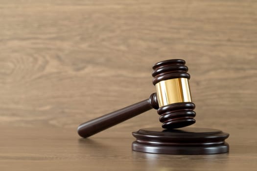 judge gavel on the brown wooden background