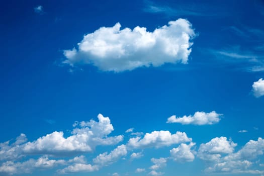 Blue sky background with a tiny clouds