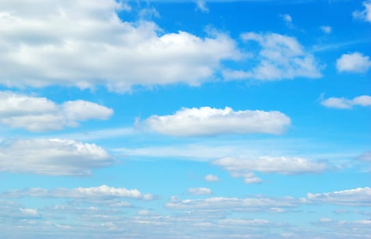 Blue sky background with a tiny clouds