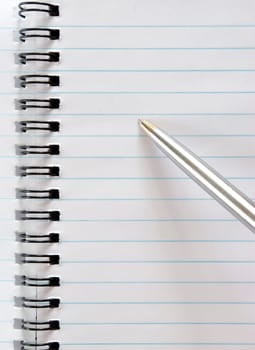 The notebook with the handle lays on a white background