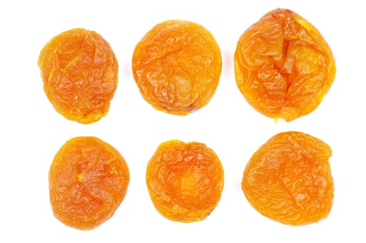 heap of dried apricots over white