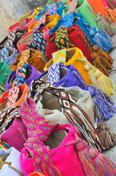 Multi-colored colombian bags on a market stall in Cartagena, Colombia