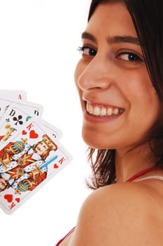 A smiling young woman in closeup holding up a deck of cards, isolated.on white background..