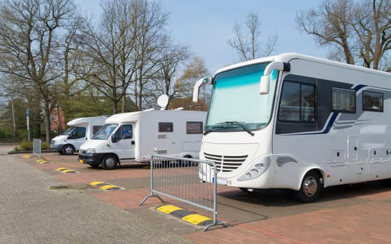 several motor-homes on a parking place