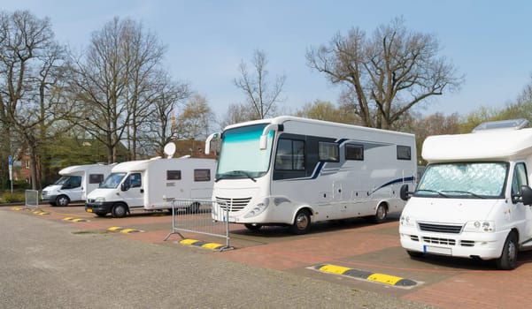 several motor-homes on a parking place