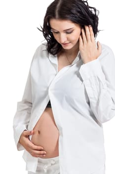 Pretty expectant mother with baby belly looking forward to her baby isolated against a white background