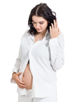 Pretty expectant mother with baby belly looking forward to her baby isolated against a white background