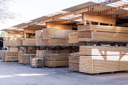 Wooden panels stacked in the warehouse for shipping or production for flooring