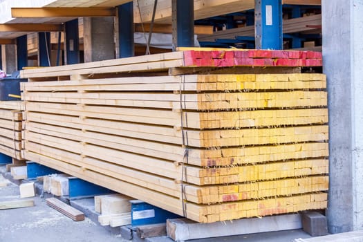 Wooden panels stacked in the warehouse for shipping or production for flooring