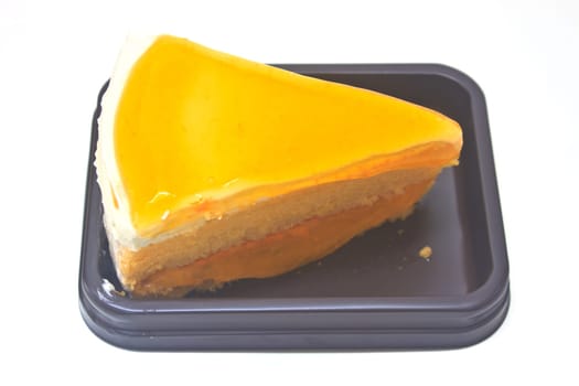 Dessert Orange Cheesecake in plate on background