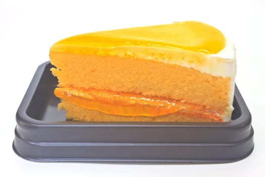Dessert Orange Cheesecake in plate on background