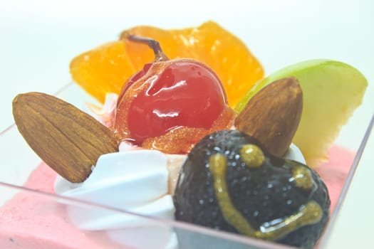 cupcake with cream and fruits on white background