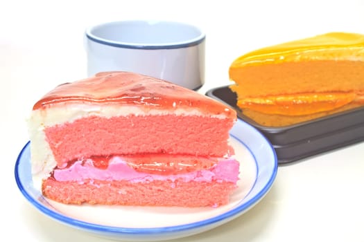 Dessert Orange Cheesecake with Strawberry cheesecake in plate on background