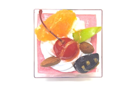 cupcake with cream and fruits on white background