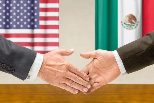 U.S. and Mexican officials shake hands