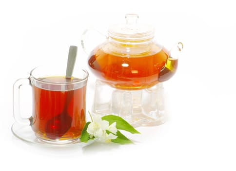 Tea being poured into glass tea cup