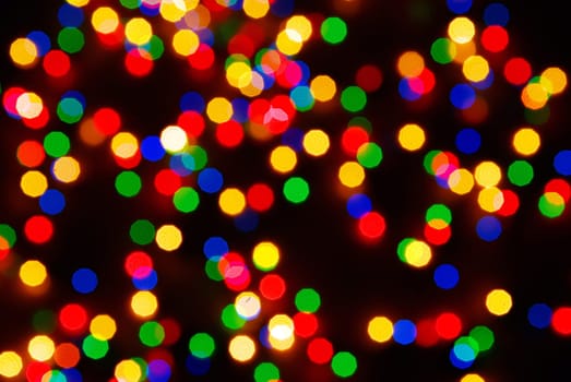 Abstract christmas lights as background on black