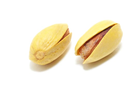 fresh pistachios isolated on a white background